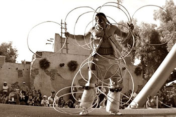 Fig 5. Potawatomi Indian, Gary Wis-Ki-Ge-Amatyuk Jr., performing an American Indian hoop dance. 
Wiskigeamatyuk.com. Web. May 1 2016. Photo taken by T.J. Sinsay of Sinsay Fitography, 2009.
